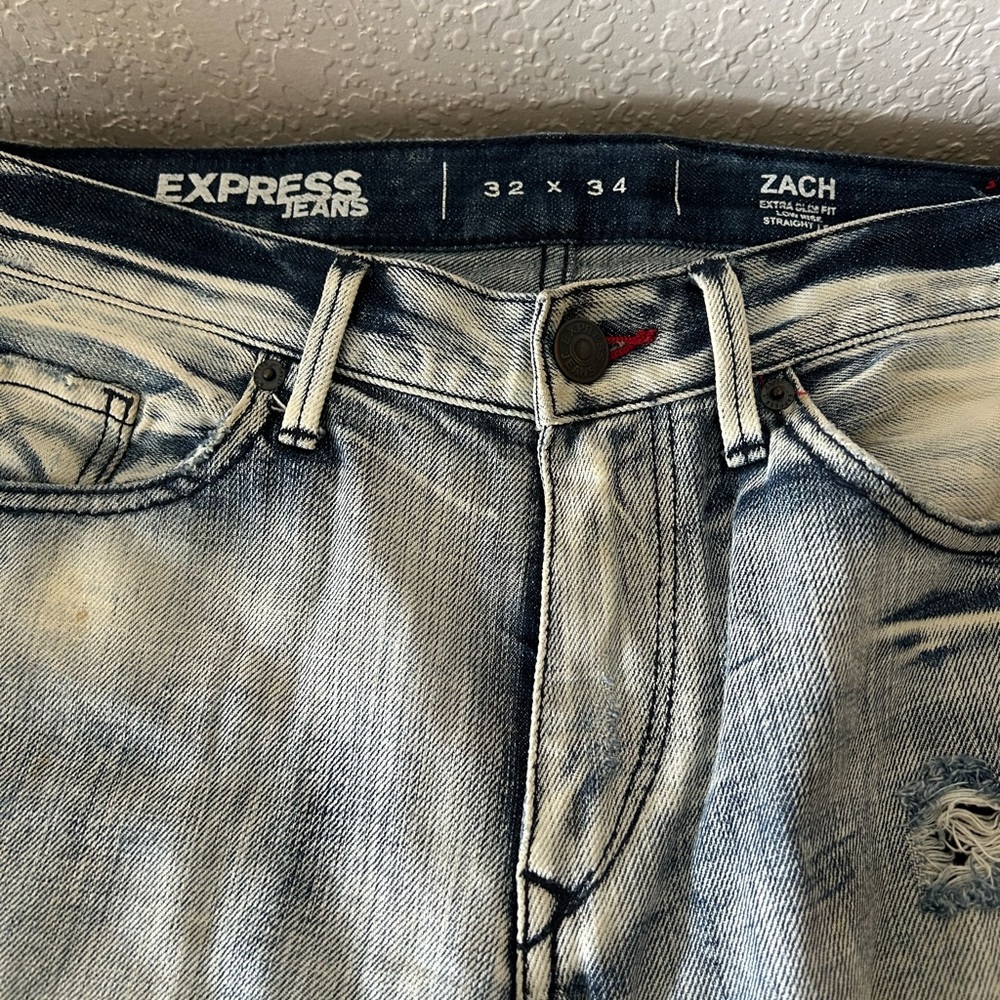 Express Zach distresses jeans.